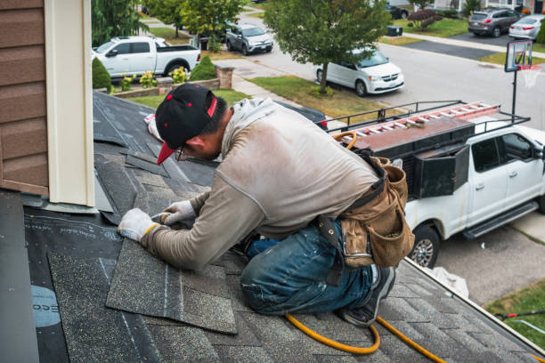 Professional Roof Replacement technician working in Scottville, MI
